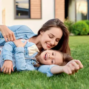 mother and daughter playing outside