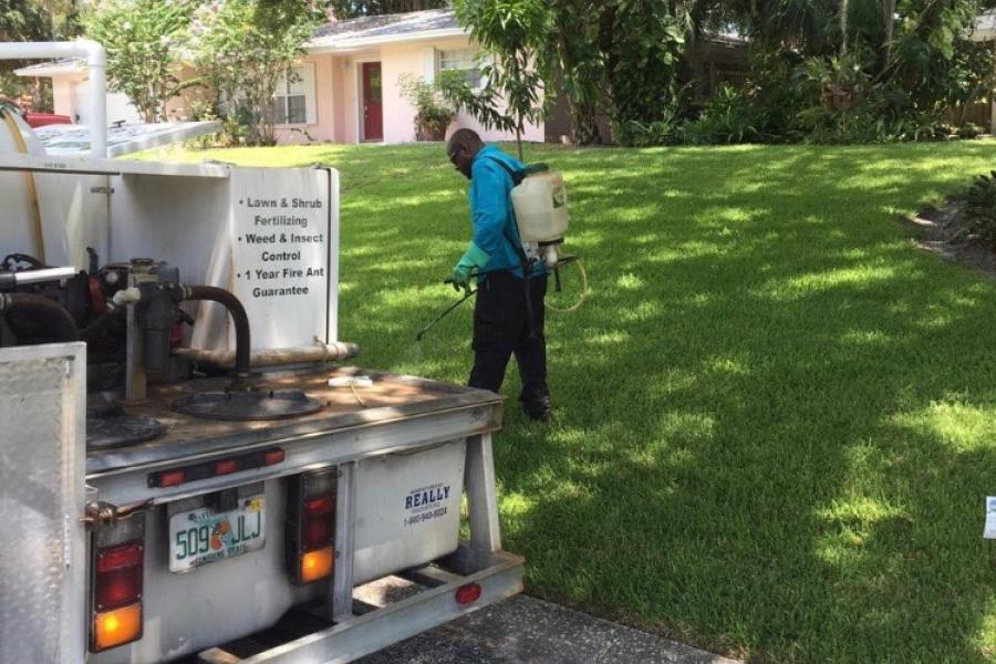 tech working on lawn