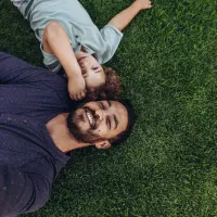 father and child on lawn