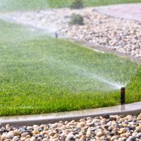 sprinkler system watering lawn