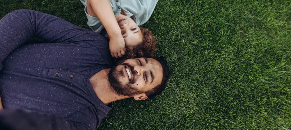 father and child on lawn