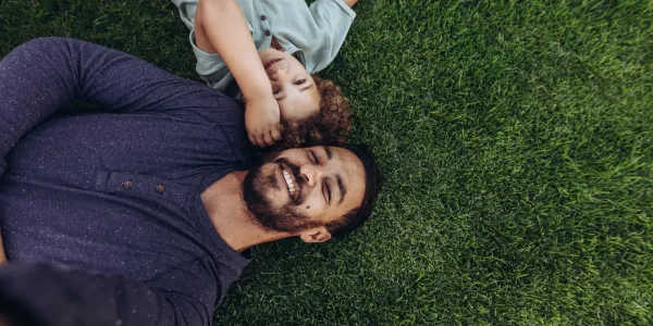 father and child on lawn
