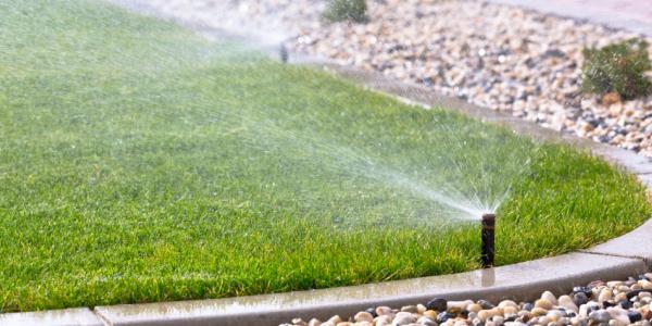 sprinkler system watering lawn